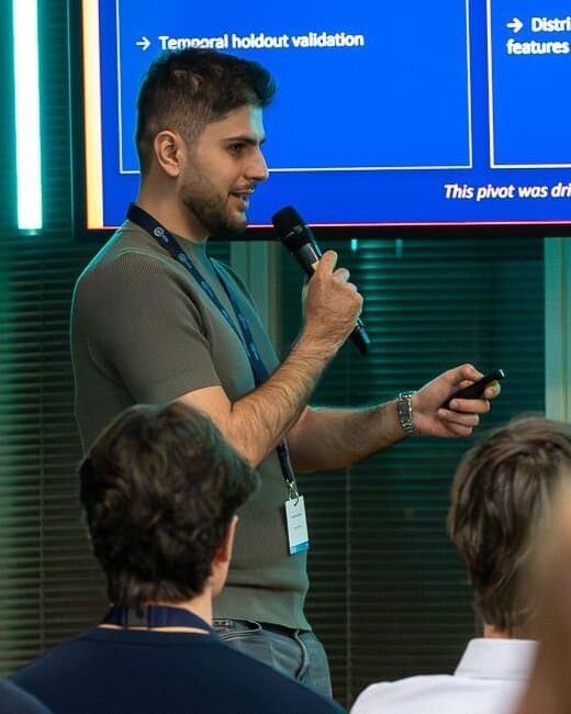 Sinan-Deniz Çeviker presenting his team’s model at the AI Cup 2026